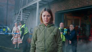 Coronation Street Abi Franklin looks concerned as chaos unfolds behind her