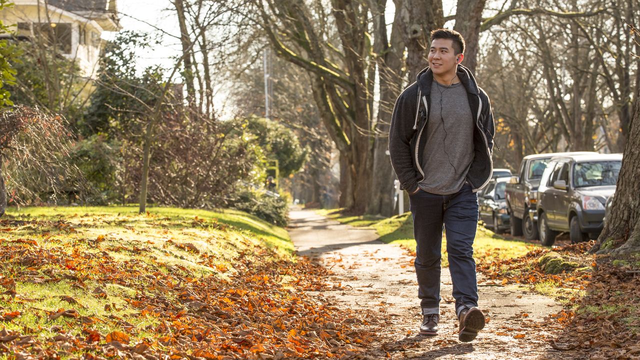 Man walking outdoors in autumn