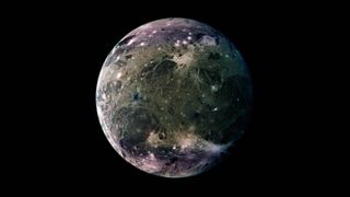 An image of Ganymede. It is a deep, grayish textured blue and green