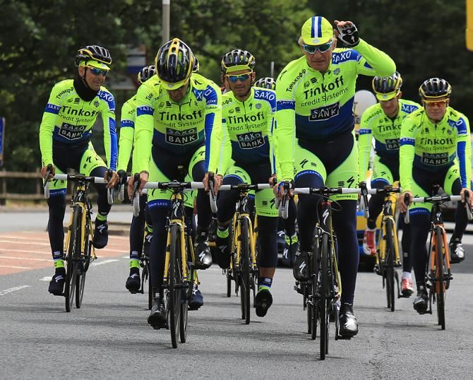 The new Tinkoff Saxo kit modeled by Oleg Tinkov and the team