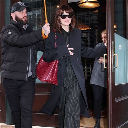 dakota johnson in a pinstripe suit
