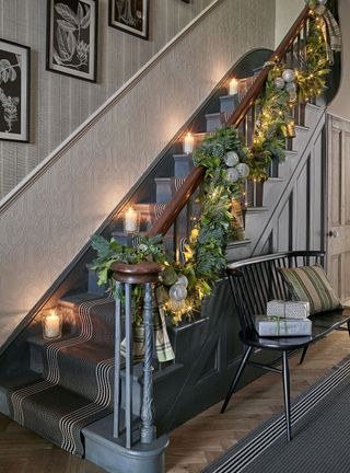 Christmas stair decor ideas with garland hung on bannister