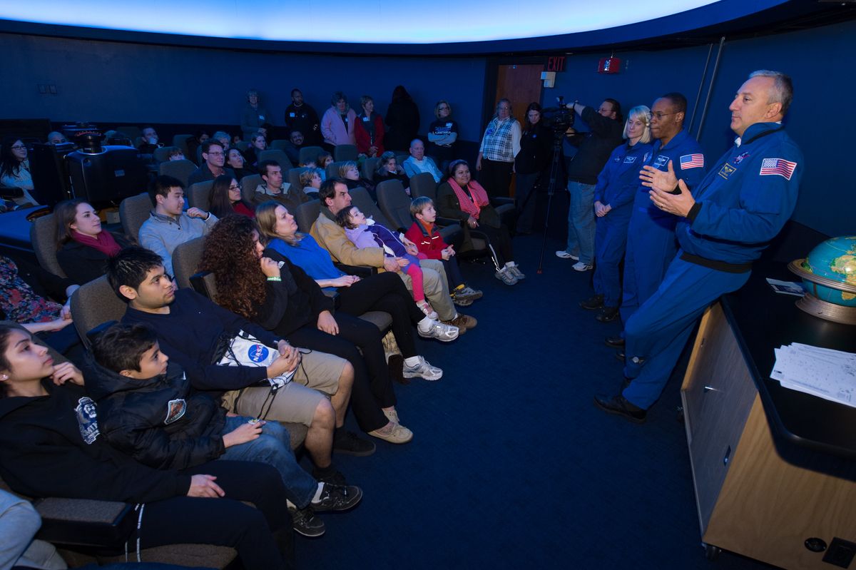 NASA astronauts Kate Rubins, Alvin Drew and Mike Massimino give a star talk at a NASA &quot;Star Party,&quot; in the David M. Brown Planetarium at the Washington-Lee High School in Arlington, Virginia, on Jan. 19, 2013.