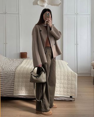 @francescasaffari wearing wide-leg trousers, cropped jacket and Birkenstocks