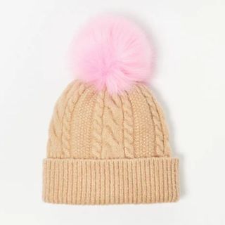 beige knitted beanie with pink pom pom