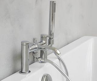 chrome bath tap and handheld shower