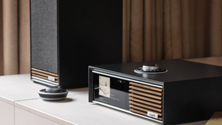 Ruark Audio R610 with Sabre-R speakers and remote on a white shelf