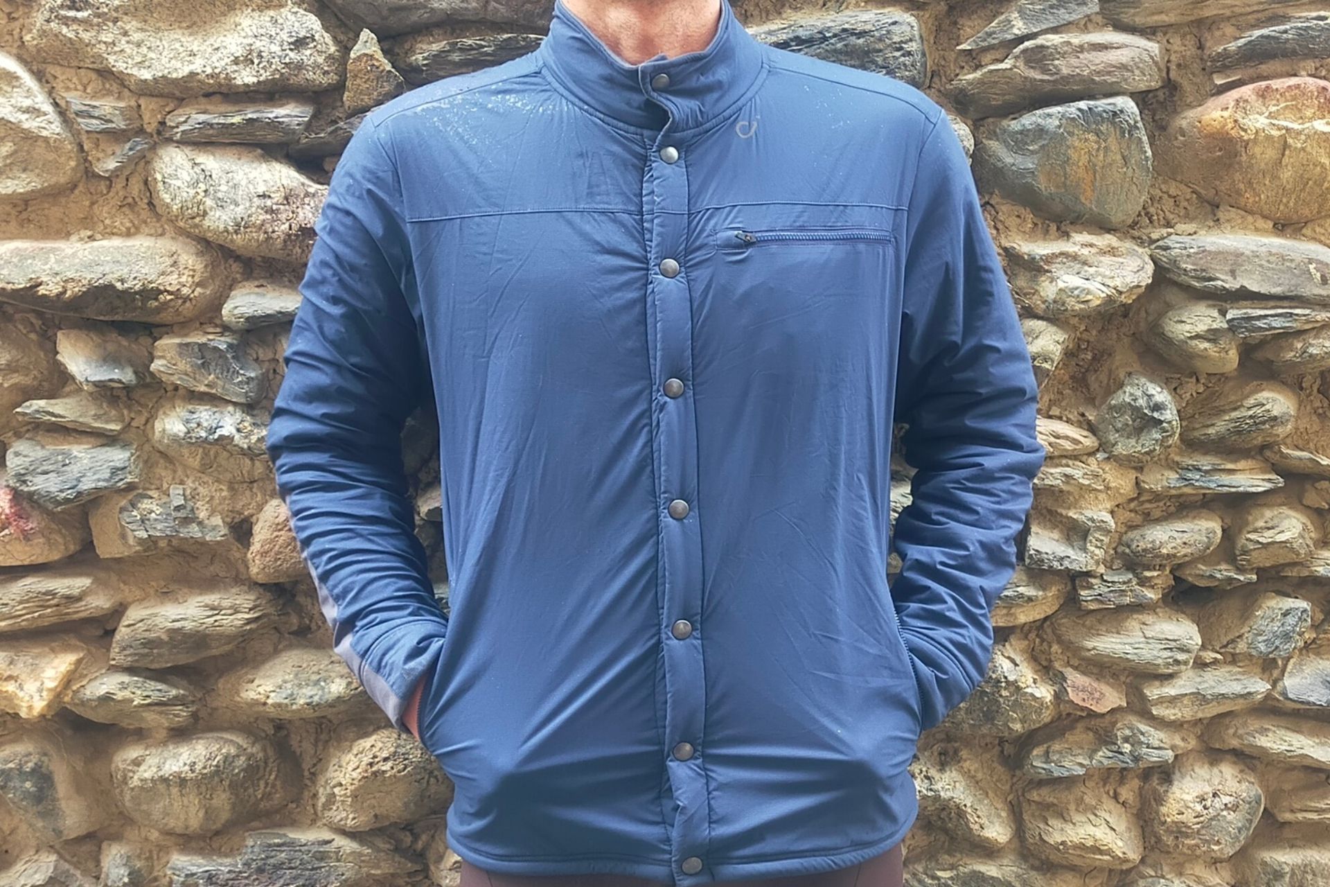 Image shows a rider wearing the Velocio Recon Snap which is one of the best commuter cycling jackets