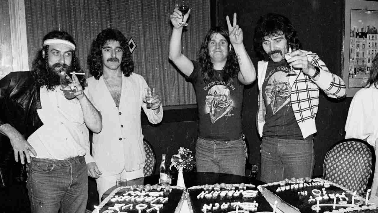 Black Sabbath celebrating their tenth anniversary with alcohol and cake