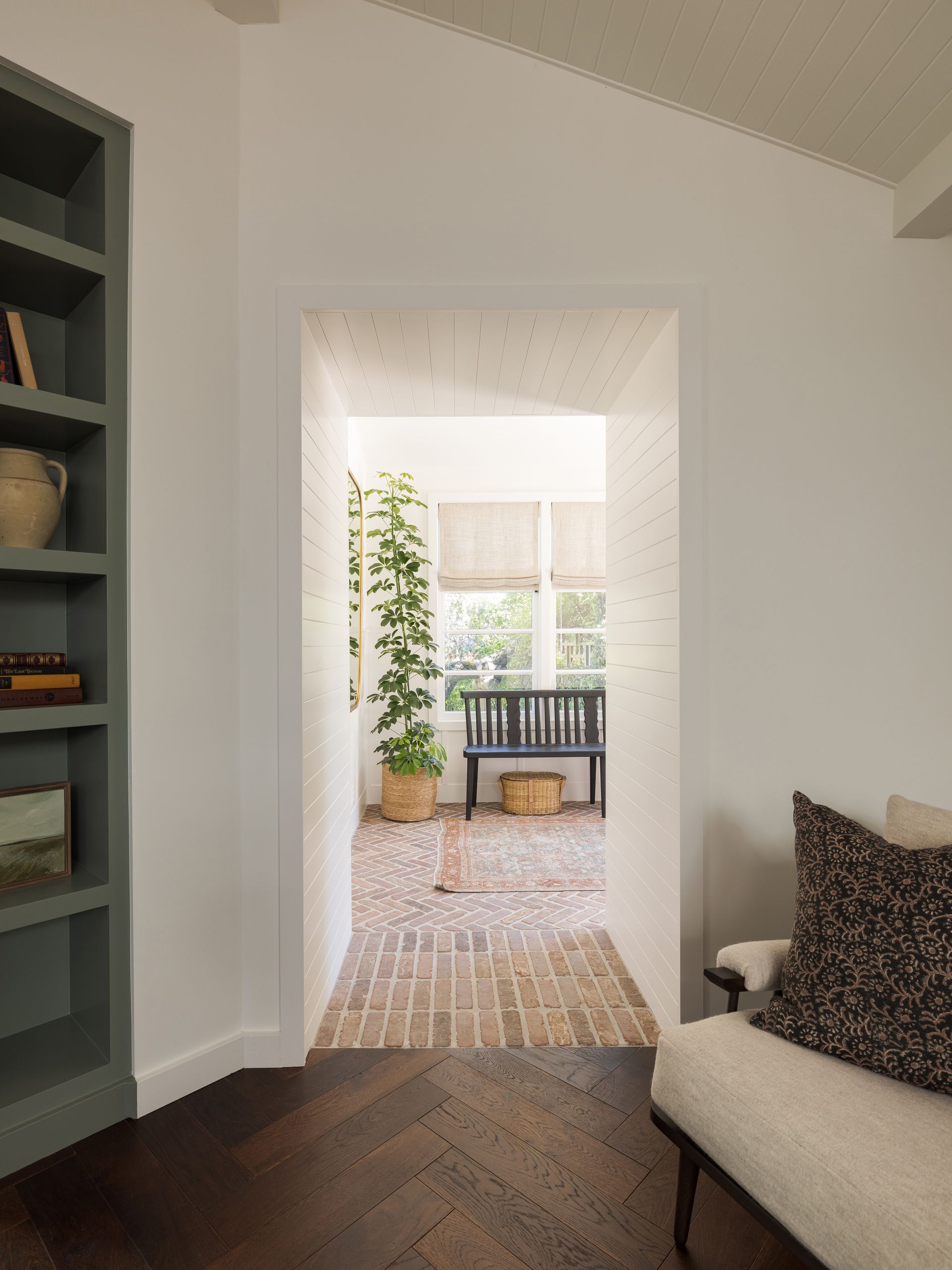 an entryway with brick flooring