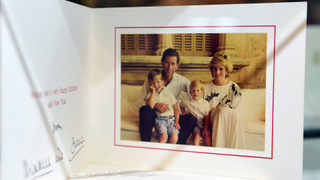 A 1987 Christmas Card signed by Prince Charles and the late Princess Diana is among items beside dresses on display at Julien's Auction House in Beverly HIlls, California on December 1, 2014, ahead of the December 5th and 6th auction of Items belonging to the late Princess