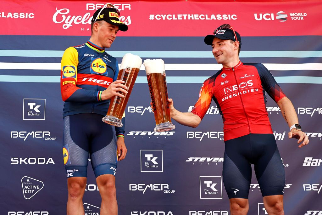 Cheers from winner Mads Pedersen (Lidl-Trek) and third-place Elia Viviani (Ineos Grenadiers)