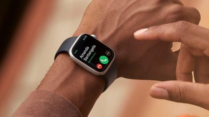 Apple Watch Series 8 on wrist of woman showing incoming call