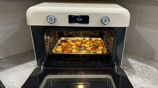 SMEG Combi Steam Oven roasts brussels sprouts and peppers