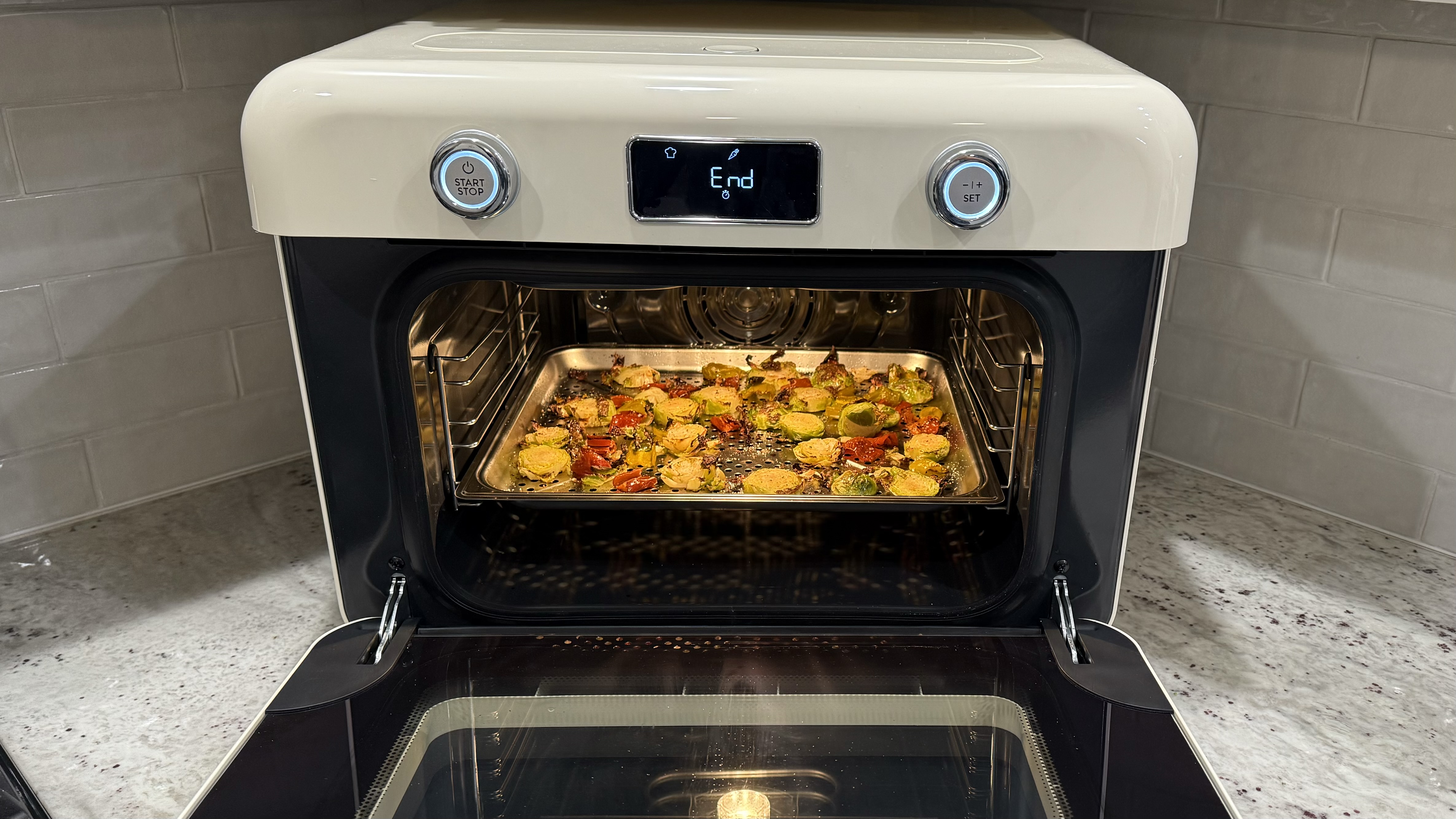 SMEG Combi Steam Oven roasts brussels sprouts and peppers