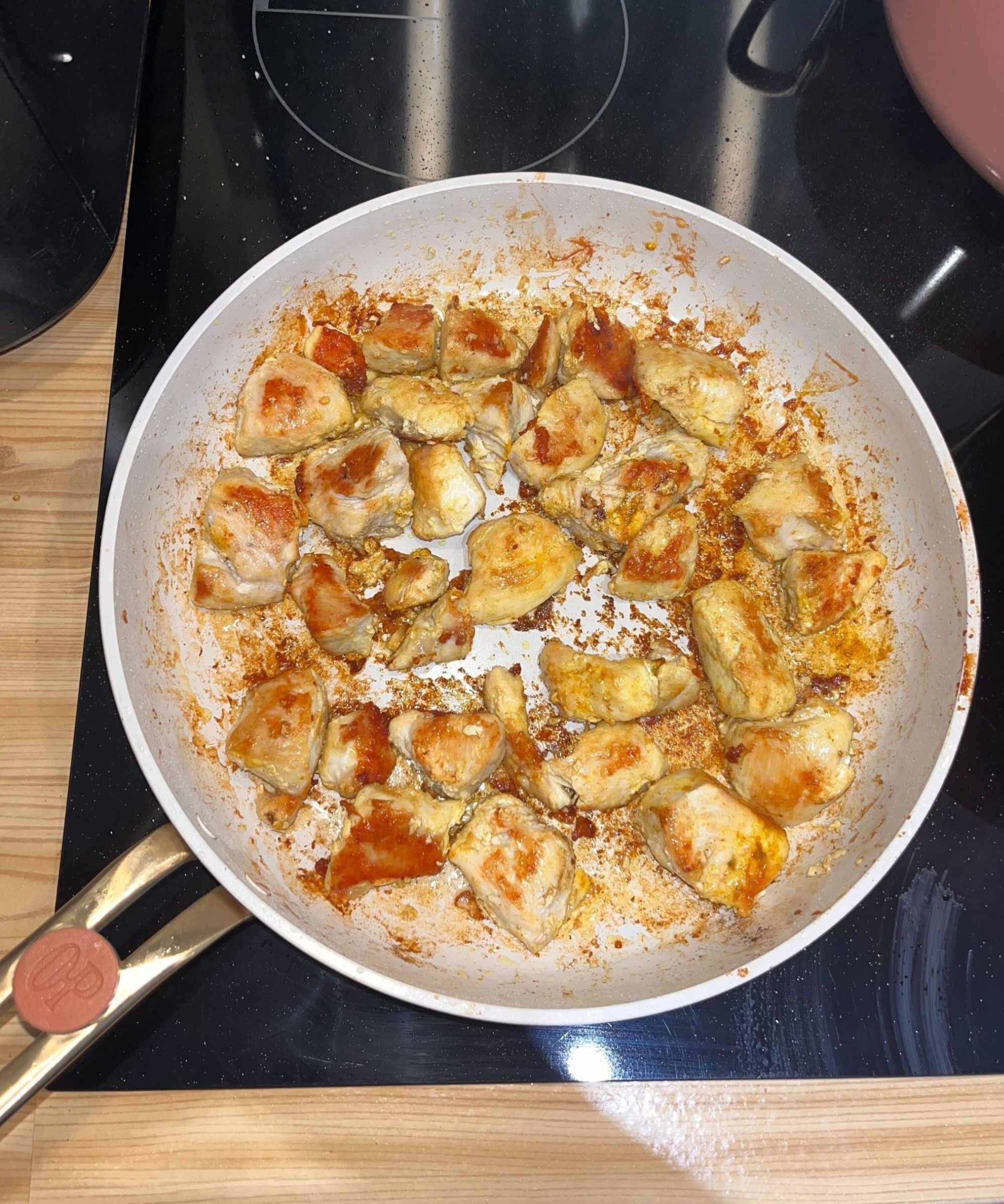 Evenly seared chicken breast pieces in the Our Place frying plan from the Essentials 11-Piece Set