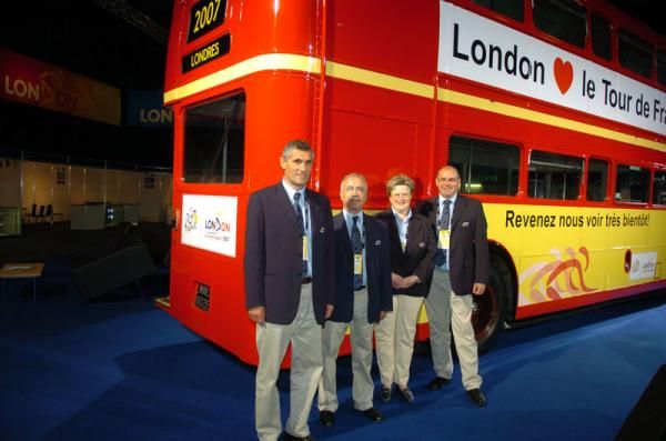 The UCI contingent pose by a red top London bus