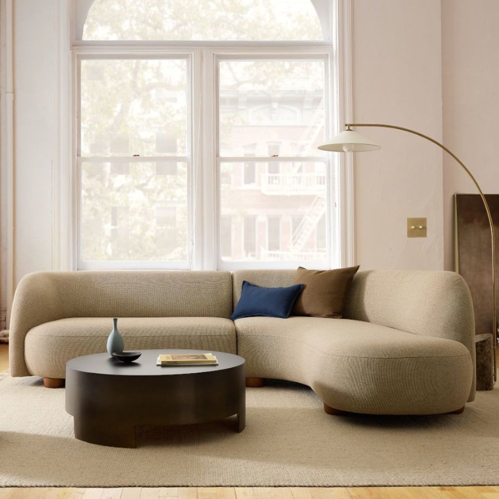 Curved beige sofa