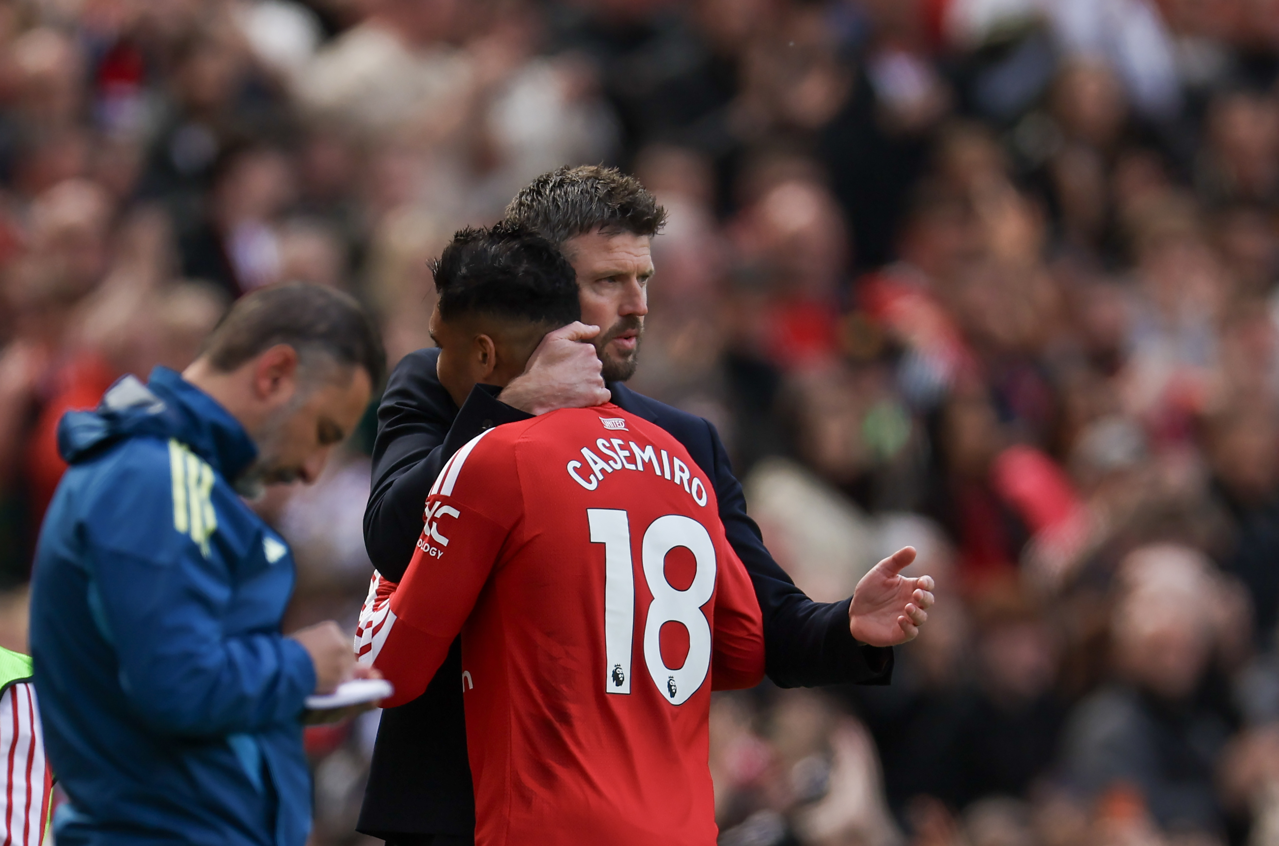 Man Utd duo Michael Carrick and Casemiro embrace at Old Trafford