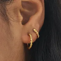 Medium Twist Gold Hoops, £60 | Spells of Love