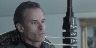 An aging Peter Weyland (Guy Pearce) sits in a chair in 'Prometheus'