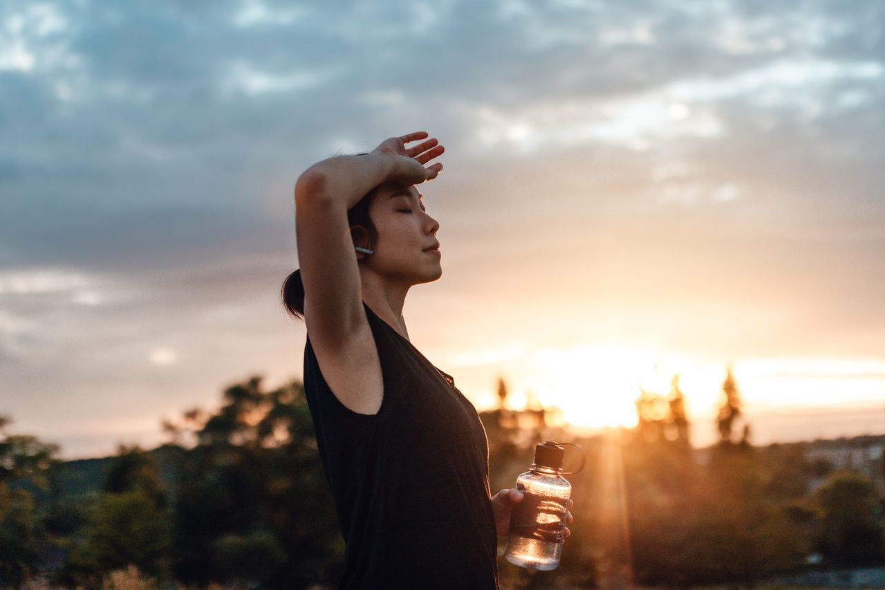 Pre-workout: A woman drinking