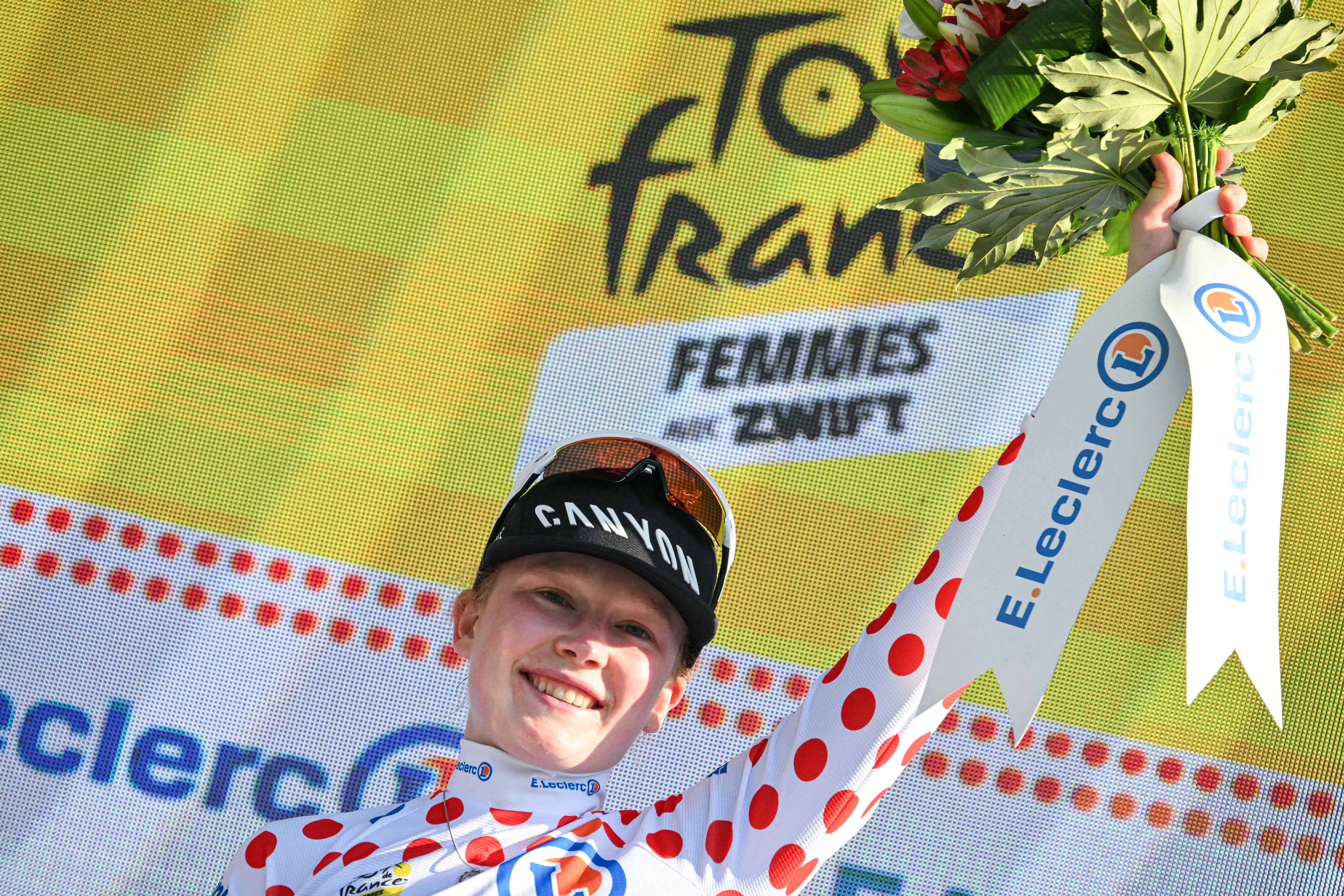 Fenix-Deceuninck's Dutch rider Puck Pieterse celebrates on the podium wearing the best climber's polka dot (dotted) jersey after the 8th (out of 9) stage of the fifth edition of the Women's Tour de France cycling race, 171.9 km from Sisteron to Nice, in Nice, southeastern France on August 8, 2026. (Photo by NICOLAS TUCAT / AFP via Getty Images)