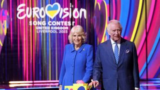 Britain's King Charles III and Britain's Camilla, Queen Consort switch on the stage lighting as they visit the host venue of this year's Eurovision Song Contest, the M&S Bank Arena in Liverpool, on April 26, 2023