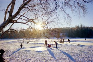 People playing in the snow in winter
