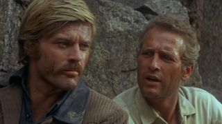 Robert Redford and Paul Newman climb a mountain in Butch Cassidy and the Sundance Kid