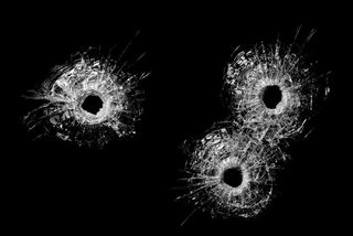 Gunshot holes in glass
