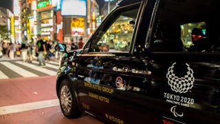 okyo taxi with the symbols of the Olympic and Paralympic Games
