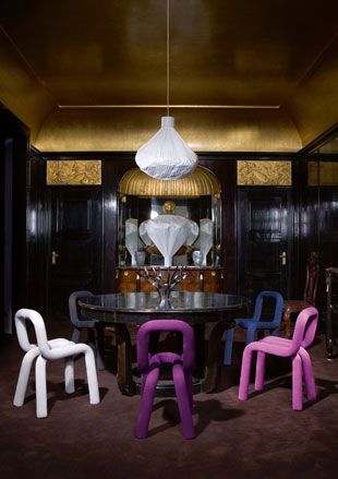 Modern colourful chairs around a round table