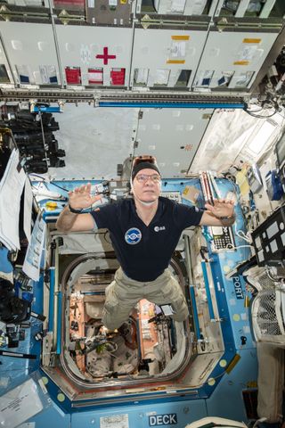 European Space Agency astronaut Paolo Nespoli wears a 3D, virtual-reality camera on his head to film a tour of the International Space Station.