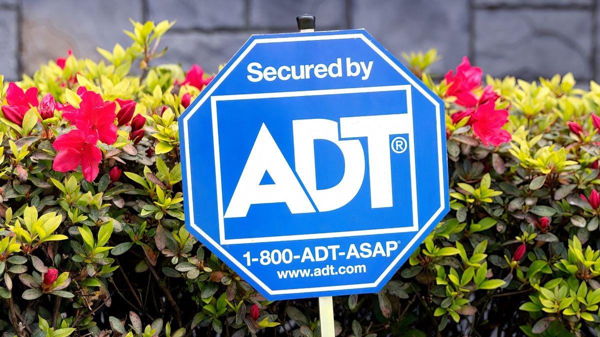 A Secured by ADT sign on a lawn