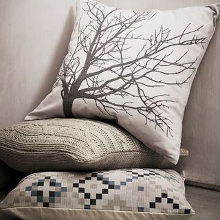 room with tree printed cushions