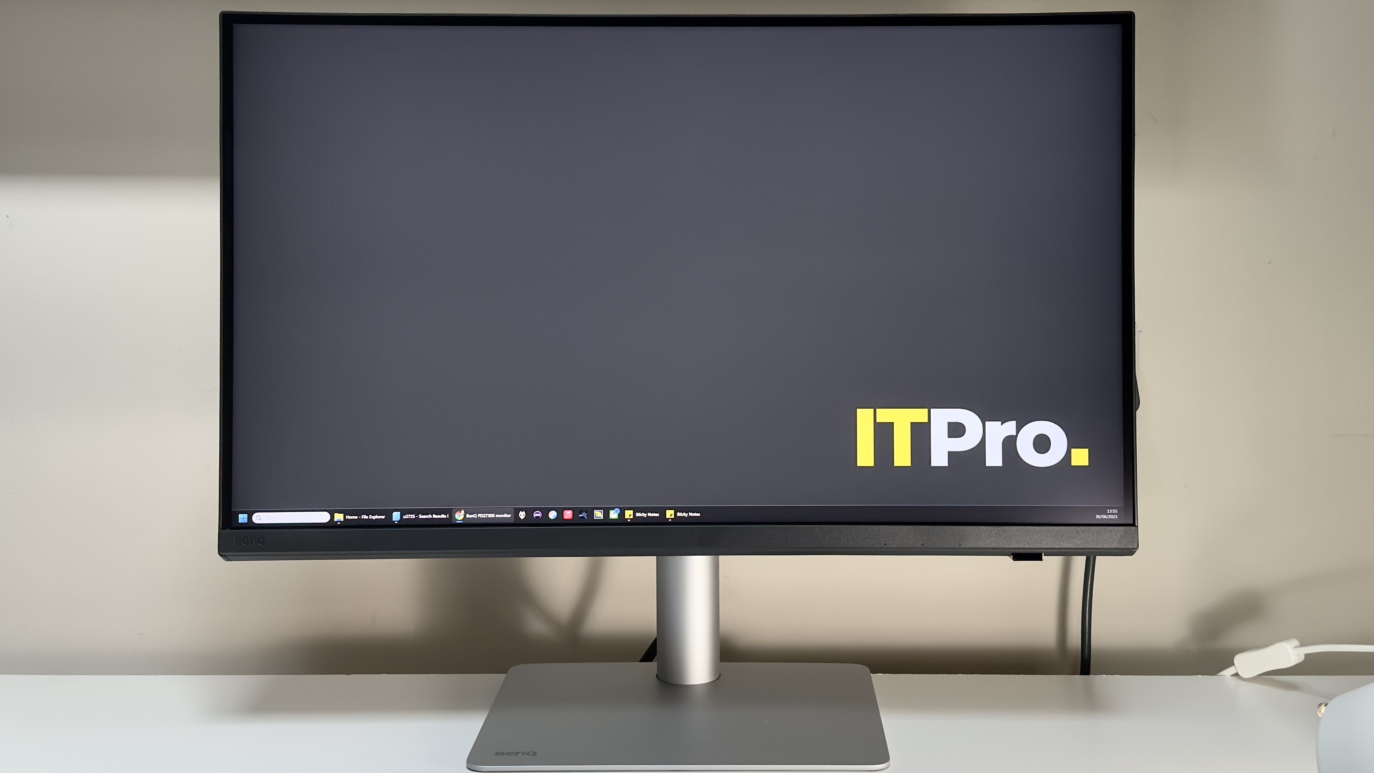 The BenQ PD2730S monitor on a desk