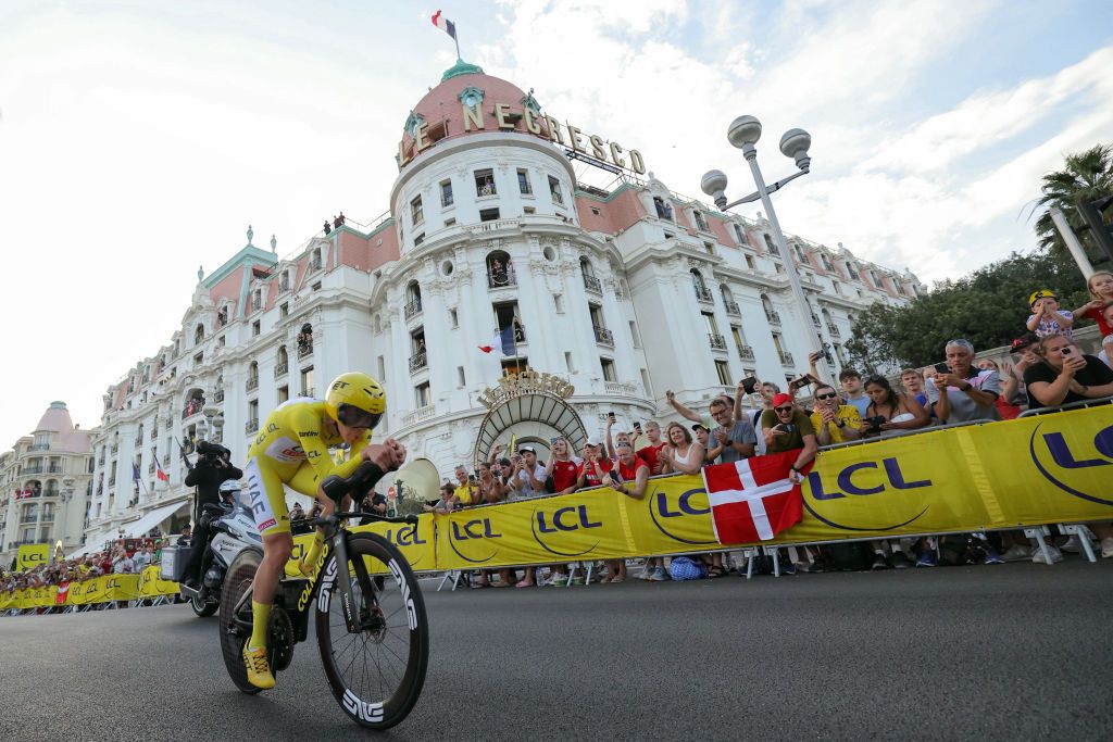 UAE Team Emirates team's Slovenian rider Tadej Pogacar cycles past the Negresco Hotel in Nice during the 21st and final stage of the 111th edition of the Tour de France cycling race, a 33,7 km individual time-trial between Monaco and Nice on the French Riviera, on July 21, 2024. (Photo by Thomas SAMSON / AFP)