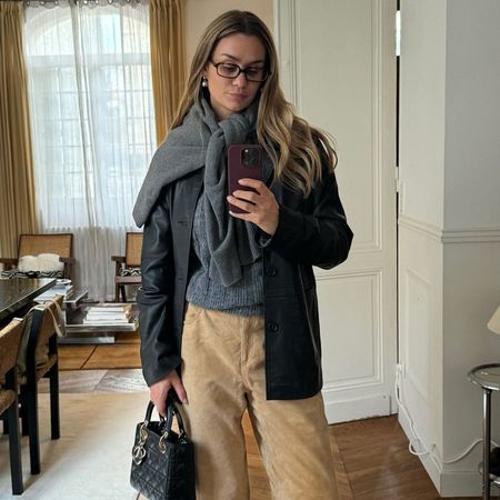 Influencer wears suede trousers.