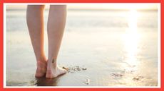 image of the back of woman's legs with a small ankle tattoo ideas, looking out to the sea on the beach with a red border around the image