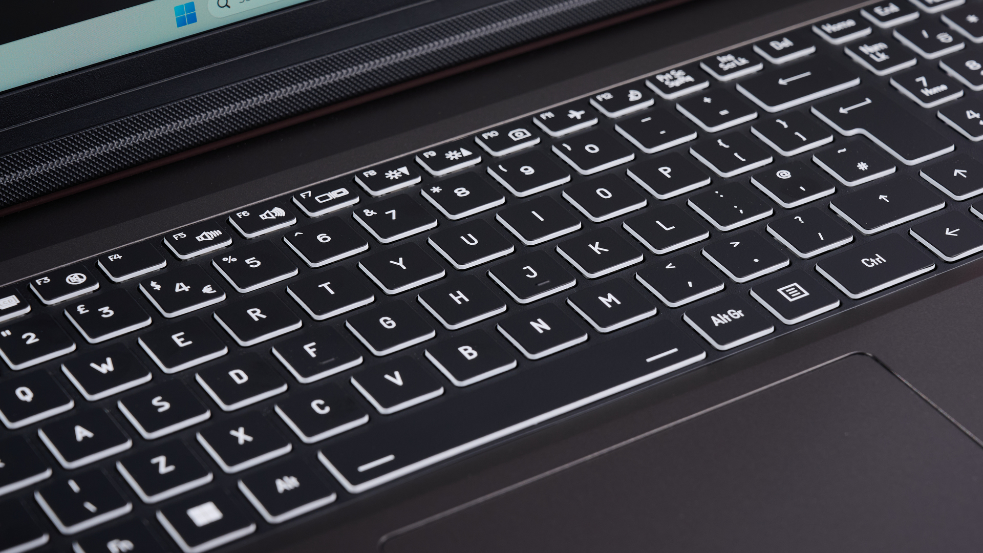 Close-up of keyboard on PC Specialist Defiance II 16 with backlighting on