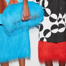 A photo of two models at the Dries Van Noten SS26 show.