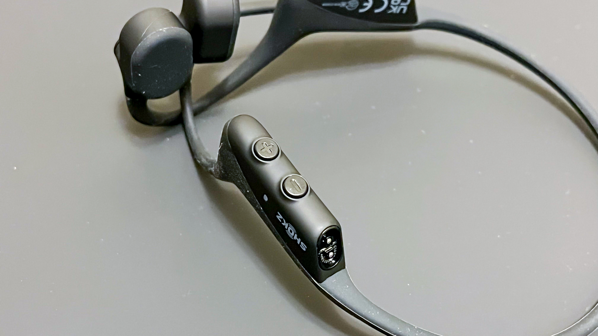 Shokz OpenComm UC on a gray surface