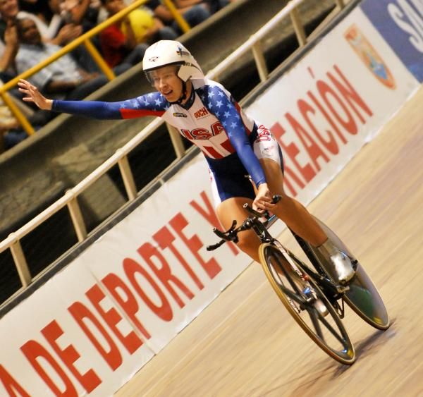 Sarah Hammer celebrates her win in the omnium scratch race that sealed the Omnium gold