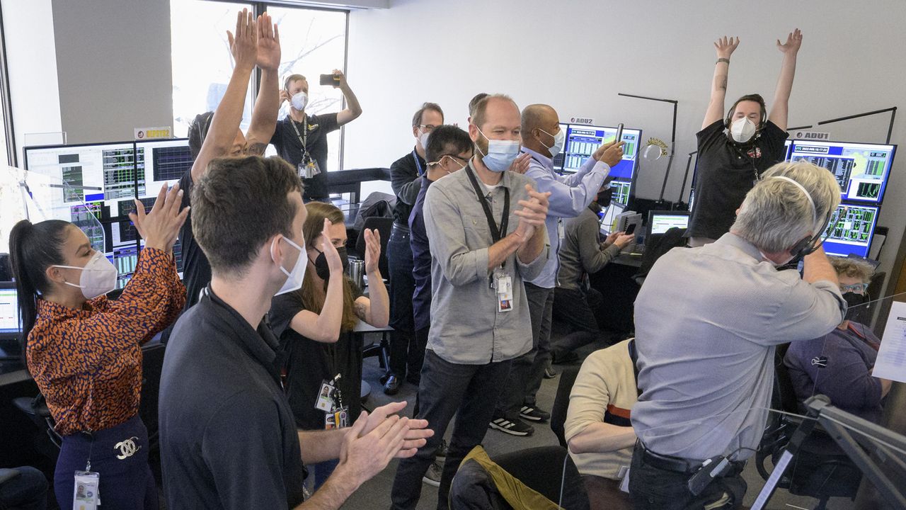 The mission operations team of NASA's James Webb Space Telescope cheers as the huge observatory unfolded its final mirror segments into place to complete its deployment on Jan. 8, 2022.