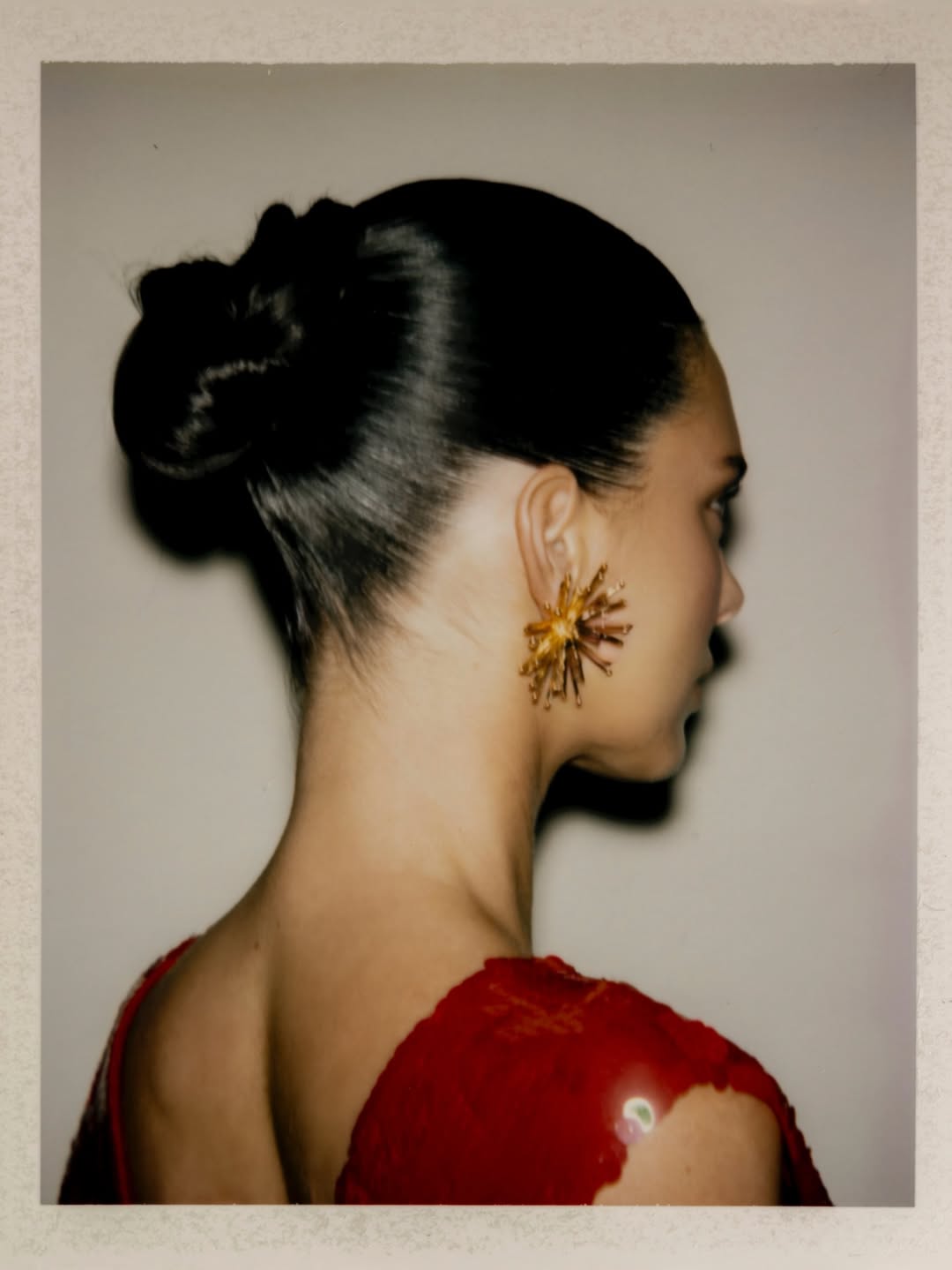 Kendall Jenner wears a Chanel runway outfit and carries a silver holiday collection quilted shoulder bag