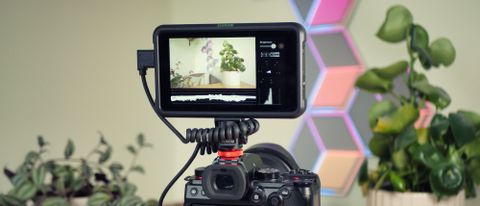 Atomos Shinobi on-camera monitor mounted on a Panasonic mirrorless camera