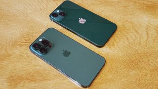 Back of green iPhone 13 and iPhone 13 Pro