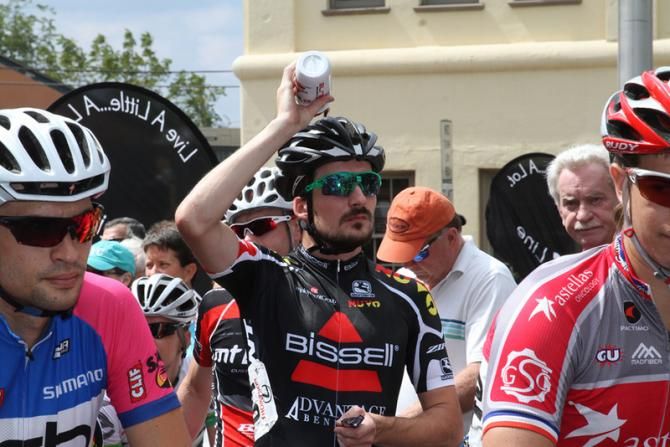 A member of the Bissell team tries to keep up with the changing weather by taking a quick shower before the start.