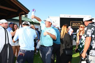 Braden Thornberry spills champagne over his playing partner